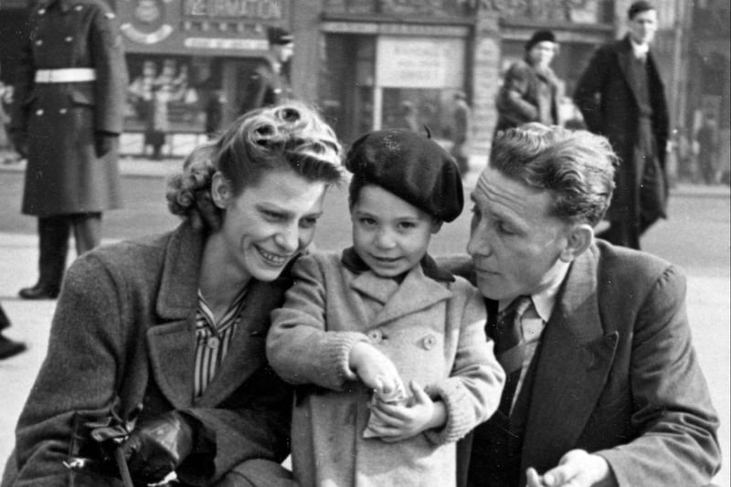 A stylish Charles Robert Watts aged two with his mother Lillian and father Charles in Trafalgar Square in 1943. Charlie was known as Charlie Boy- while his dad was called Charlie. This previously unseen image will formed part of The Rolling Stones - Exhibitionism at London’s Saatchi Gallery in April 2016. (Photo by Linda Roots/Getty Images)