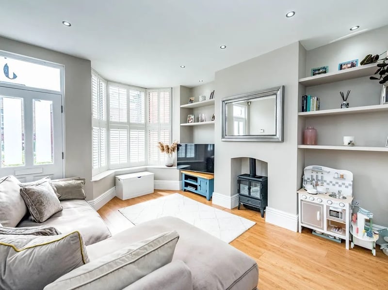 The living room in this terraced house is very spacious and bright. (Photo courtesy of Whitehornes Estate Agents)