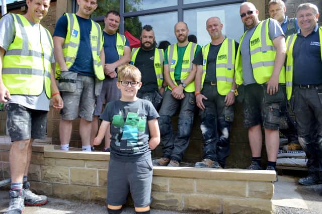 Luke Mortimer with the Band of Builders team. Picture: BandofBuilders/AdamMortimer/SWNS