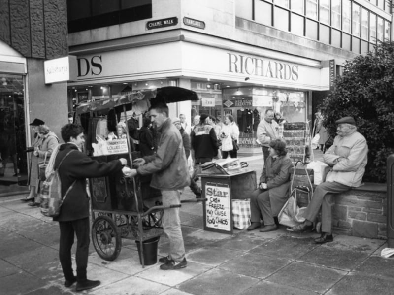 Newspaper and chestnut sellers outside Richards, at the junction of Fargate and Chapel Walk, Sheffield, in November 1992. Photo: Picture Sheffield