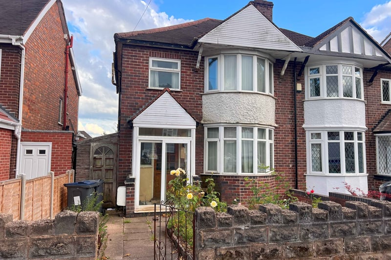 This is a four-bedroomed, semi-detached house at 17 Woodacre Road across the city in Erdington, with a guide price of £49,000+. This freehold property stands back from the road with front and back gardens, plus the potential to add rear access for vehicles via a service road, subject to planning permission. There is a porch, hall with understairs cupboard, two reception rooms, kitchen and covered side passageway on the ground floor, and then a landing, three bedrooms, bathroom and toilet upstairs.     There is another bedroom on the second floor and the property has partial double glazing and gas central heating.