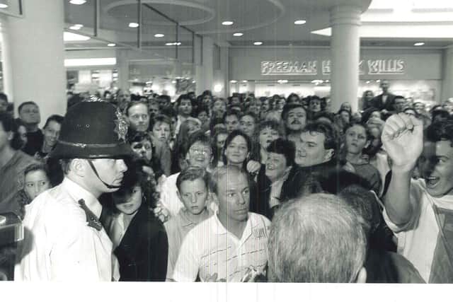 Police attempt to control crowds on Meadowhall launch day 33 years ago.