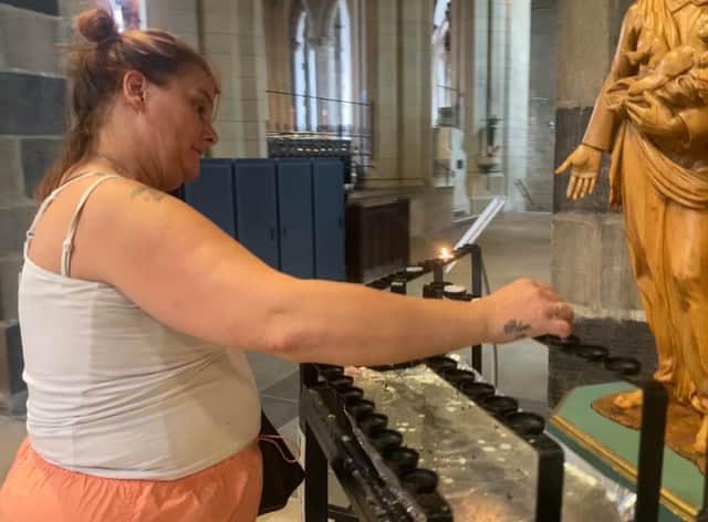 Jo lights a candle in Glynn's memory every day at the Cathedral.