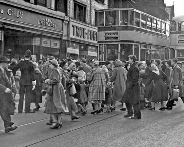 Shoppers at Haymarket, Sheffield city centre, in 1953, showing F.W. Woolworth and Co. Ltd. and True Form Boot Co. Photo: Picture Sheffield/Press Photo Agency