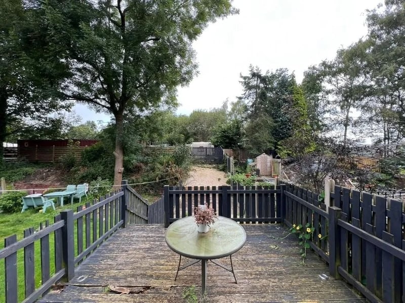 The garden features a wooden patio, which leads down to the rest of the garden. (Photo courtesy of Zoopla)