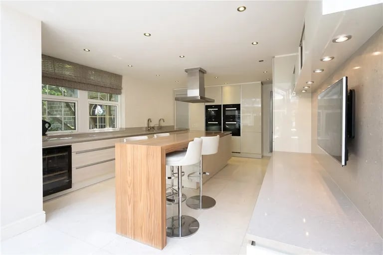A modern fitted kitchen with isle.