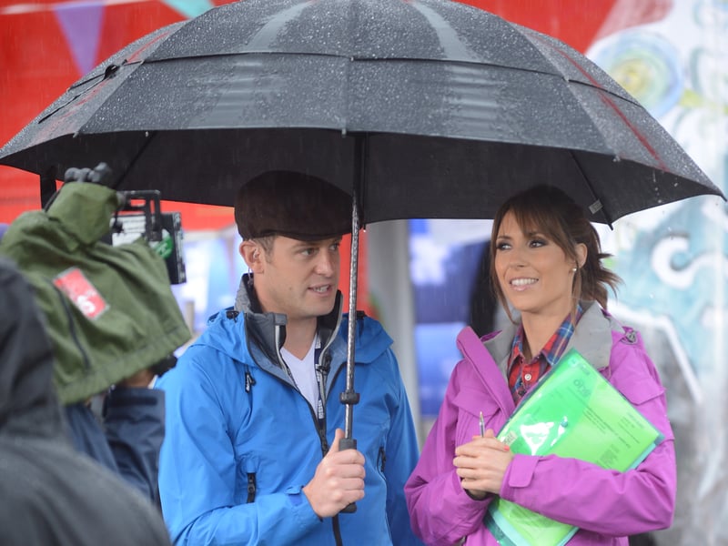 Presenters Matt Baker and Alex Jones get ready for a rain-soaked show as BBC's The One Show comes to Endcliffe Park, Sheffield, in August 2012