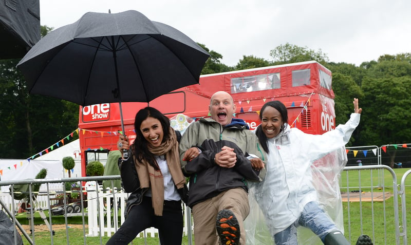 The One Show presenters Anita Rani, Mike Dilger and Angellica Bell get into the spirit as the weather fails to dampen their enthusiasm during the road show in Endcliffe Park, Sheffield, in August 2012