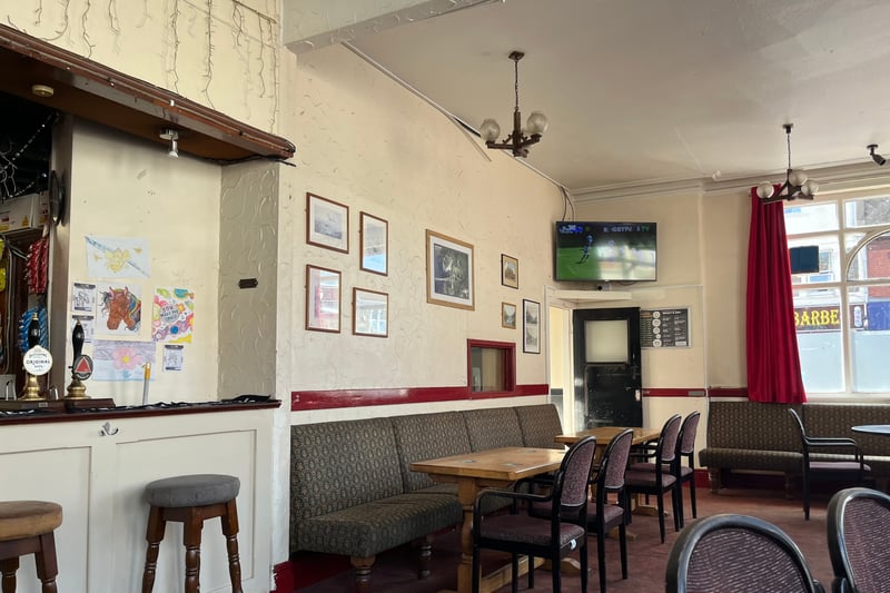 The Sandringham has a traditional pub look and walls are covered with old pictures of Bristol.