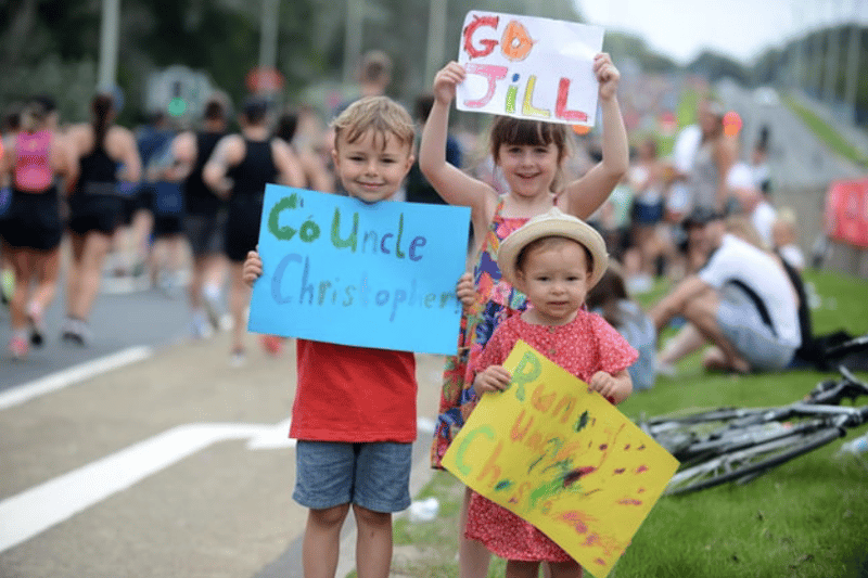 Children cheering on loved ones Credit: Stu Norton