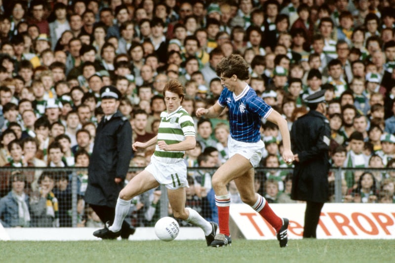 Jim Melrose of Celtic goes past Rangers player Dave McPherson with the famous ‘Jungle’ at Celtic Park in view. 