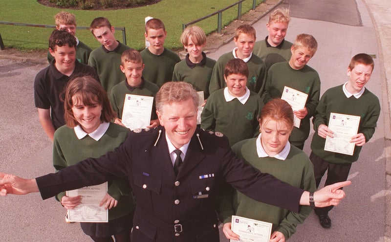 Chief Constable (Designate) Mike Hedges pictured with Year 10 pupils at Sheffield's Meadowhead School who received certificates for their work in the community in 1998. With Mr Hedges are Kelly Gregory (left) and Zoe Twigg (both 15)