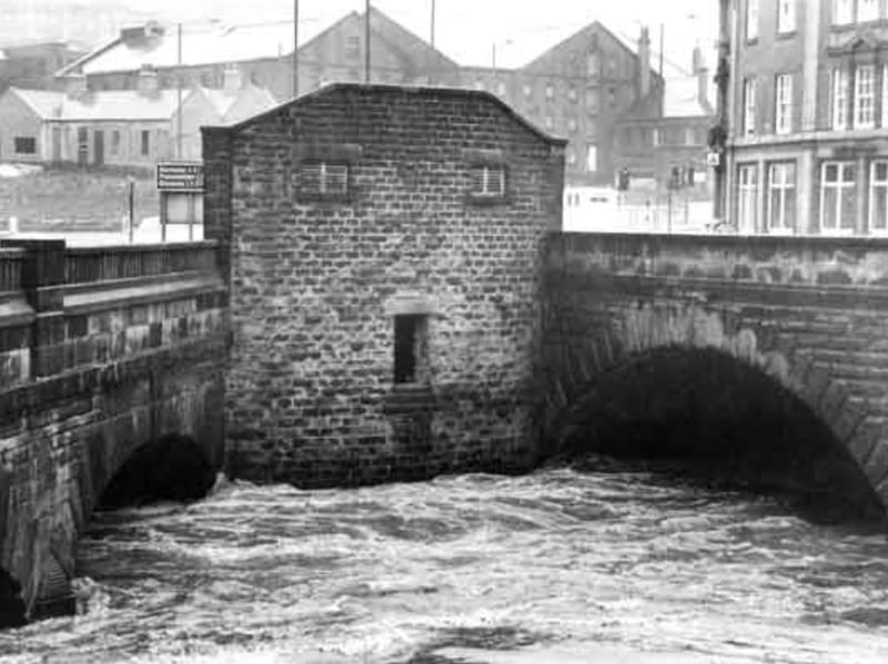 The River Don where it meets the River Sheaf, at the junction of Castlegate and Blonk Street, following heavy rain in June 1982. The public lavatories can be seen in the centre. Photo: Picture Sheffield/Sheffield Newspapers