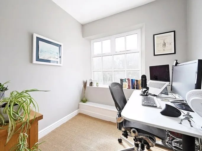 A smaller, single bedroom is currently being used as a home office. (Photo courtesy of Zoopla)