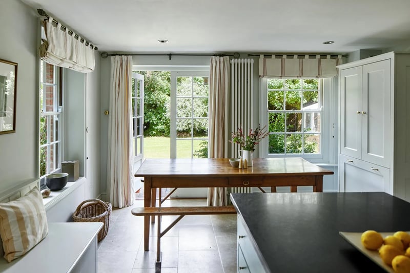 The kitchen leads to the garden via French doors 