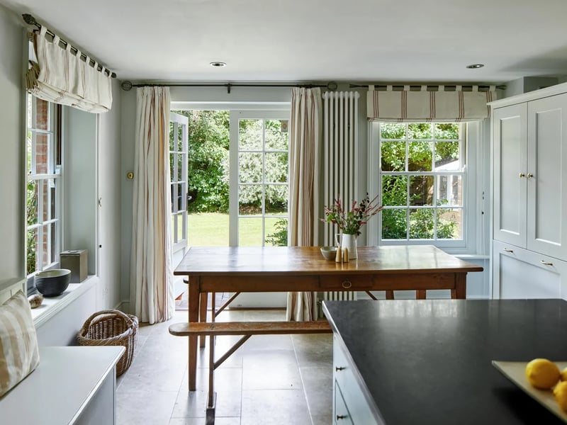 The kitchen leads to the garden via French doors 