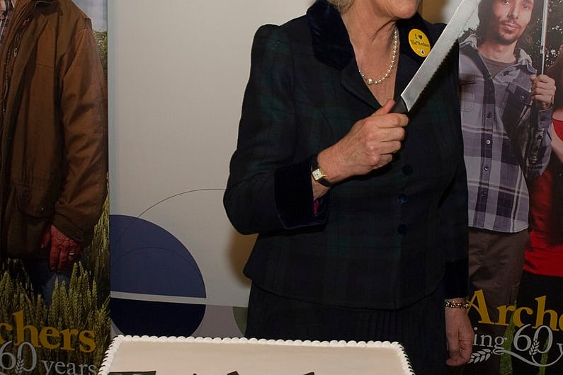Queen Camilla with The Archers Birthday cake during the Duchess’s visit to BBC Birmingham on February 16, 2011 in Birmingham, England. The Duchess toured the Mailbox building, seeing the regional newsroom, local radio production facilities, Gardener’s World, the Asian Network and the Rural Affairs Unit. The Duchess then visited The Archers studio and meet cast and crew before attending a reception to celebrate the 60th anniversary of The Archers. (Photo by Arthur Edwards - WPA Pool via Getty Images)