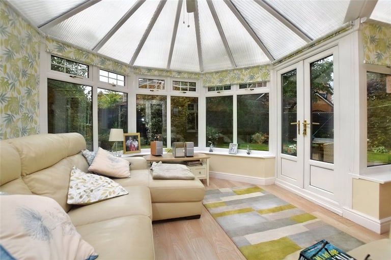 The stunning large conservatory sits to the rear and connects the dining room and the rear garden.