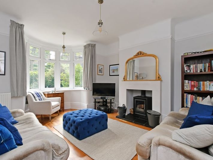 The lounge is extremely bright thanks to the massive bay window. (Photo courtesy of Zoopla)