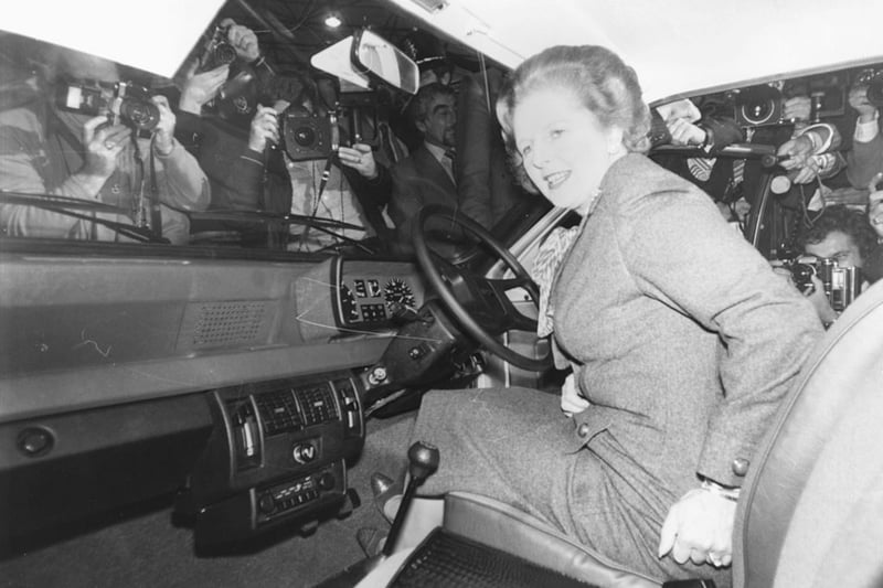 British Prime Minister Margaret Thatcher is surrounded by press photographers as she arrives in her Mini Metro car to open the International Motor Show, Birmingham, England, October 17th 1980. (Photo by Graham Turner/Keystone/Getty Images)