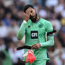 Wes Foderingham reacts after receiving a knock to the head during the Premier League football match between Tottenham Hotspur and Sheffield United at Tottenham Hotspur Stadium . (Photo by JUSTIN TALLIS/AFP via Getty Images)