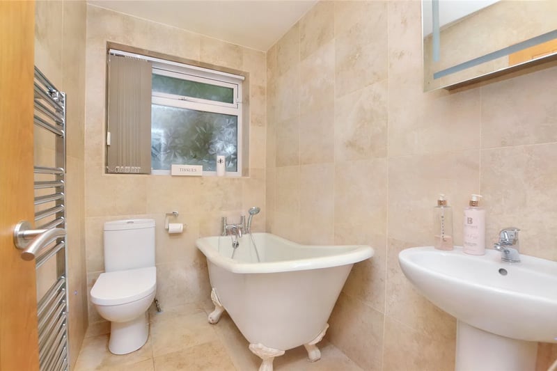 The family bathroom is fitted with a roll-top bath.