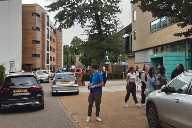 The staff are primarily university students, many of whom will have moved out of these halls just a few months ago, who today are tasked with negotiating crowds of teenagers alongside the hundreds of cars, driven by parents and full of their belongings.