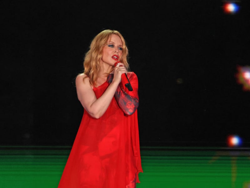 Before she was a pop princess, Kylie Minogue played tomboy Charlene in Neighbours, with her character's romance and eventual marriage to Jason Donovan's Scott providing the programmes highest ratings. Since then she has become the highest-selling female Australian artist of all time, with over 80 million record sales worldwide. She's also starred in films like 'Holy Motors', 'The Delinquents' and 'Street Fighter'. Accolades include a Grammy and three Brits.

