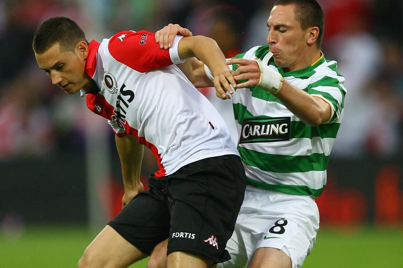 Luigi Bruins of Feyenoord is tackled by Scott Brown of Celtic during the first-half