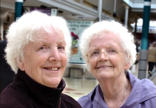 Georgina Summers with her twin Margaret Irving, right. A soggy Summer was no problem for them in 2012.