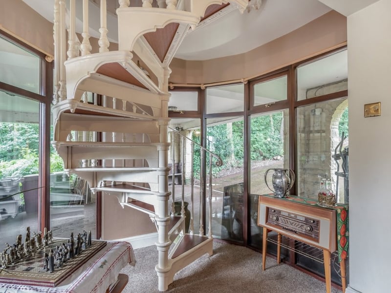 This spiral staircase will take you up to the first floor. (Photo courtesy of Fine & Country)