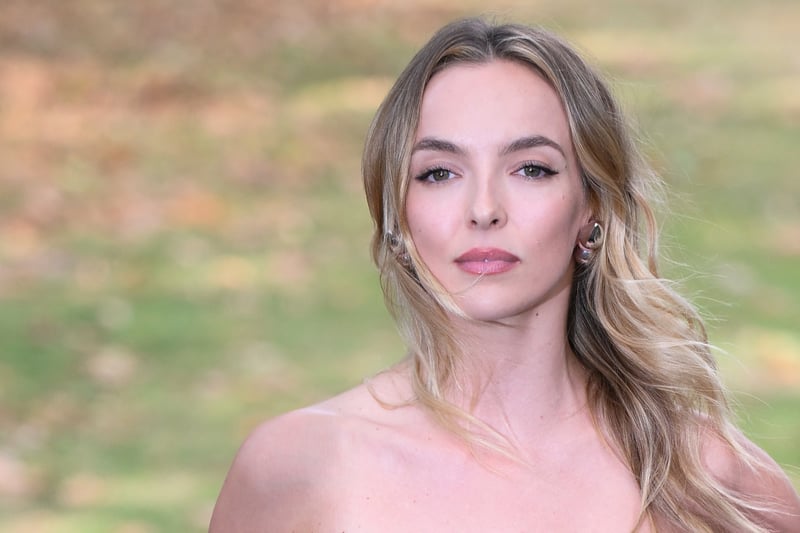 The Killing Eve star wore a navy tartan strapless number to Burberry's London Fashion Week festivities. 