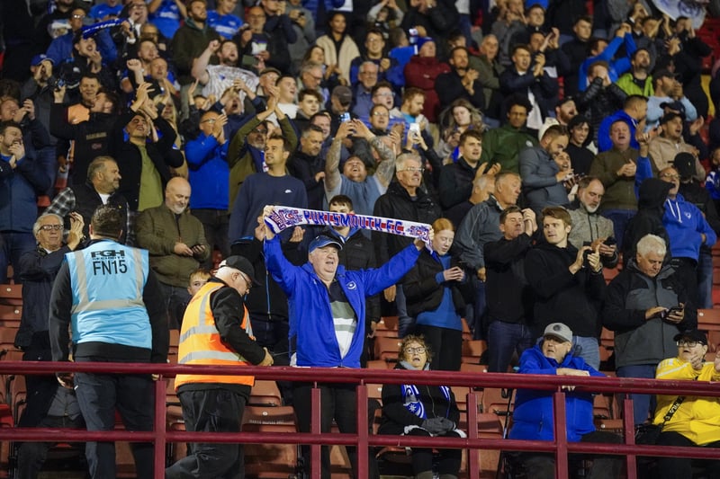A wide-angle shot of Pompey fans chanting against Barnsley