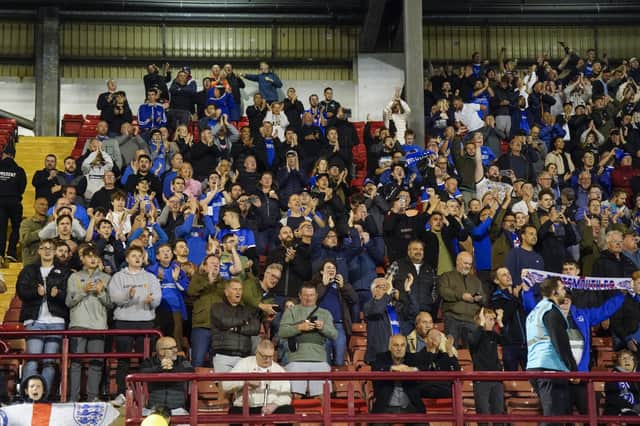 Pompey fans at Oakwell showing their support