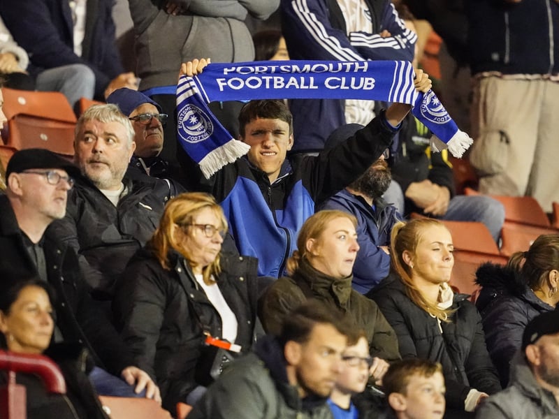 Another Pompey fans proudly displays his scarf. 