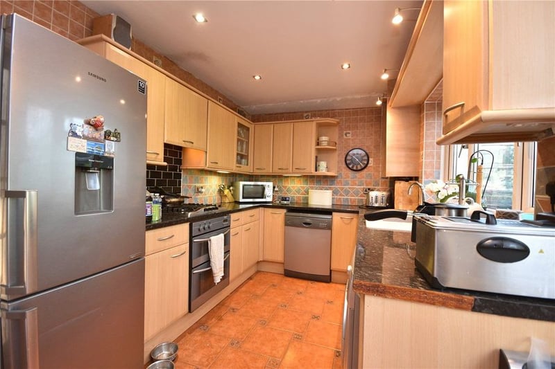 The kitchen has a range of fitted wall and base units.