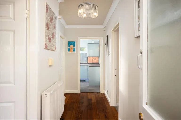 The bright and spacious entry hall with walnut flooring.