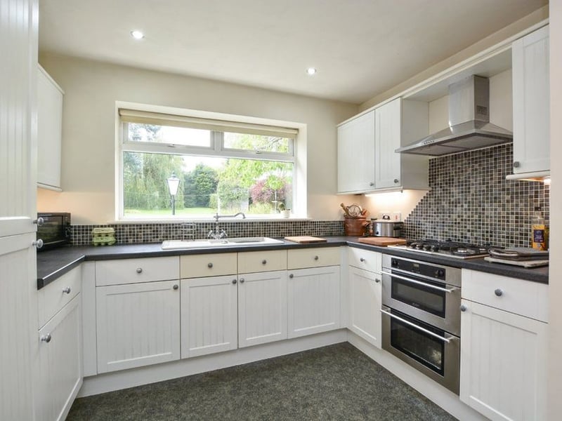 The modern kitchen with a range of wall and base units.