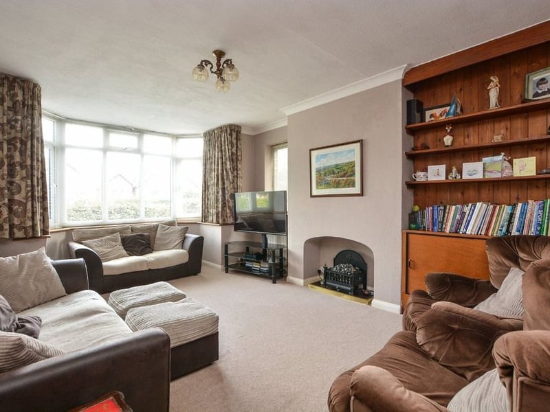 The large living room with bay window.