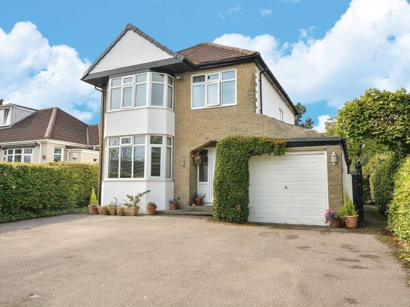 Double gates open to this sizeable driveway and integrated garage.