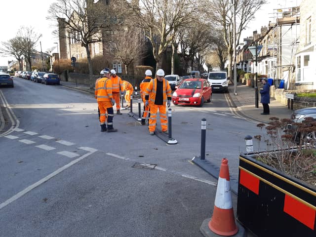 Workmen putting in barriers on Springvale Road, Crookes as part of the Active Travel Neighbourhood. They were later removed. Now Sheffield Council has made its decision on the scheme. Picture: National World