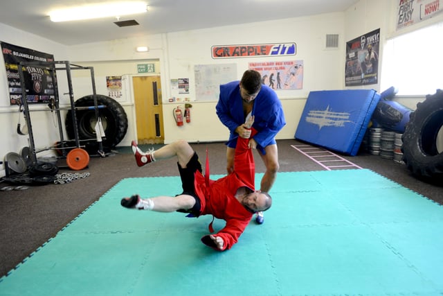 Barry Gibson (blue) with wrestling training partner Steve Taylor (red) at the gym at Wearside House, Carley Hill 10 years ago.
