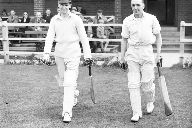 H P Clode (left) and T Moffat leave the pavilion to open Wearmouth's innings against South Shields at Carley Hill in 1955.