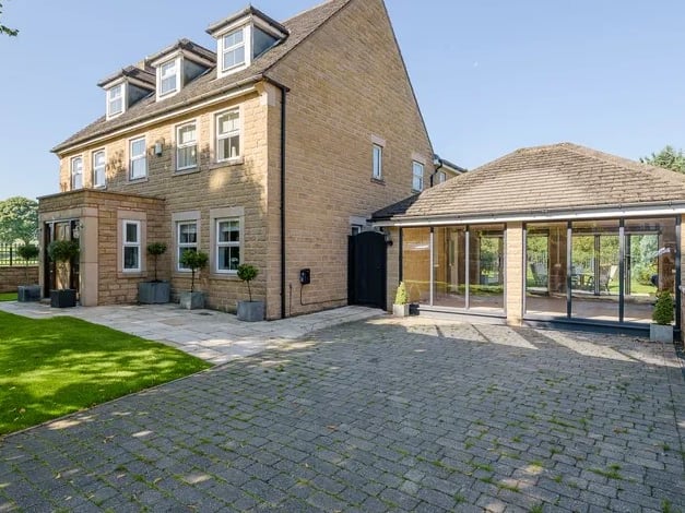 This grand home is found within a gated plot on a street named after one of the King's Royal Residences. (Photo courtesy of Whitehornes Estate Agents)