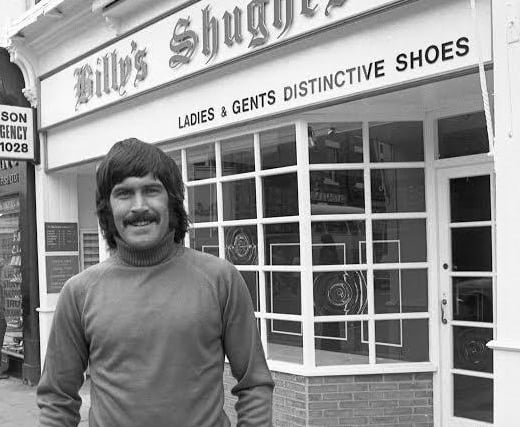 Footballer Billy Hughes pictured outside his new shop in Vine Place in 1975.