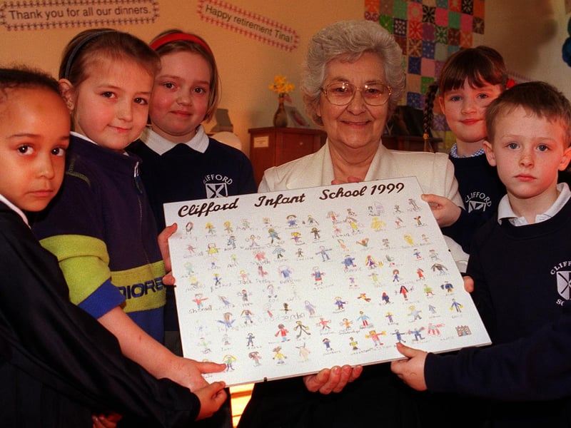 Dinner lady Tina Armitage pictured with children at her retirement party at Clifford Infant School, on Psalter Lane, where she had worked for the past 29 years