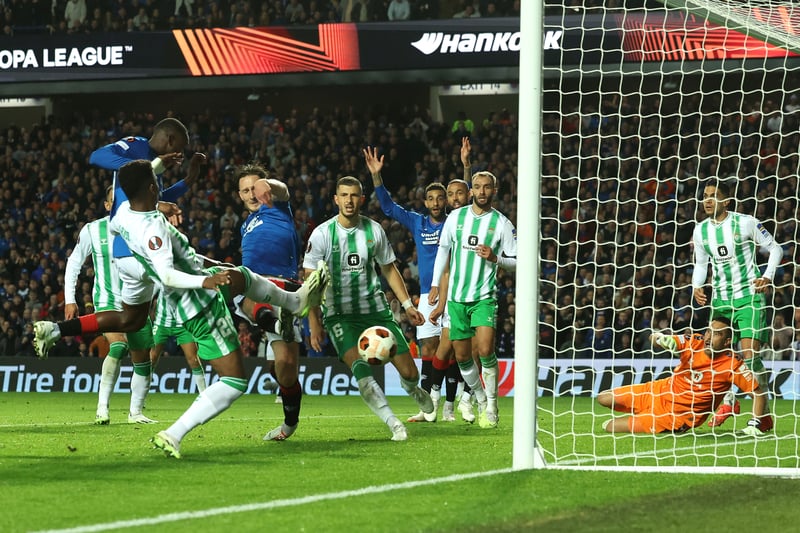 Rangers defender (centre) pokes home the only goal of the match against Real Betis.