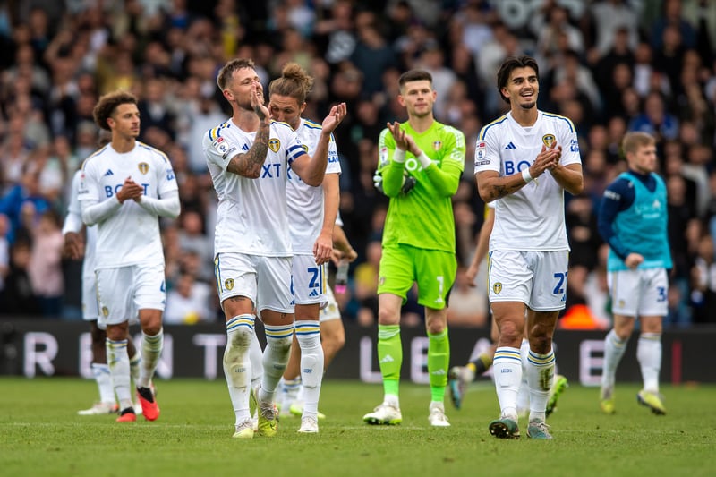 Liam Cooper leads the full-time celebrations alongside some of his Leeds teammates. 