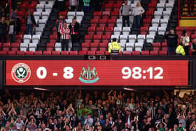 A general view of the scoreboard showing 0 - 8 as Newcastle United fans celebrate following the Premier League match between Sheffield United and Newcastle United at Bramall Lane on September 24, 2023 in Sheffield, England. (Photo by George Wood/Getty Images)