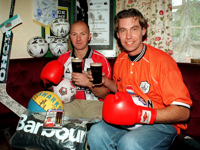 Wayne Simpson, left, landlord of the Pack Horse pub, in High Green, Sheffield, with Neil Kitson, who was going to Bosnia for charity and auctioning his sporting memorabilia